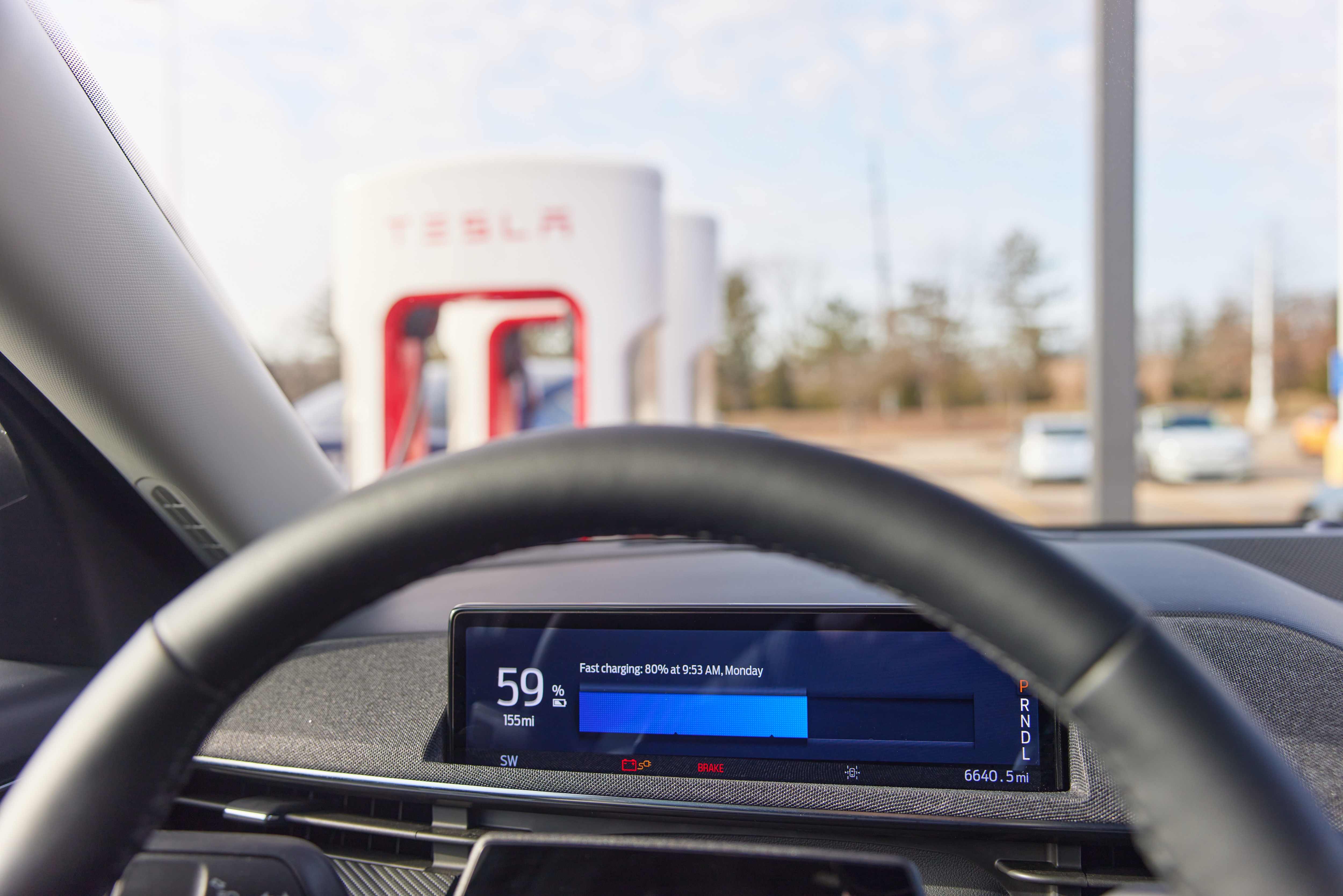 The in-vehicle instrument cluster, which shows charging progress.